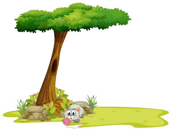 Кіт грає під деревом — стоковий вектор