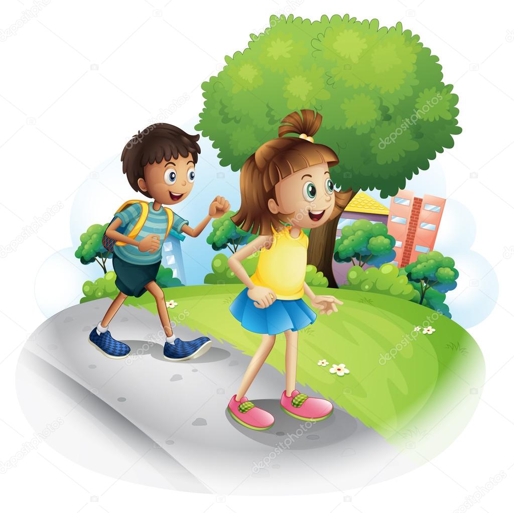 A girl and a boy walking along the street