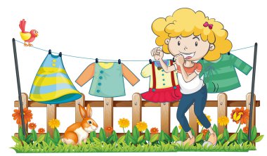 bir kadının elbiselerini ahşap çit bahçe içinde asılı