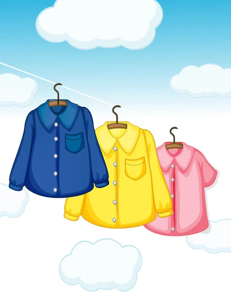 Tres tipos diferentes de ropa colgando — Vector de stock