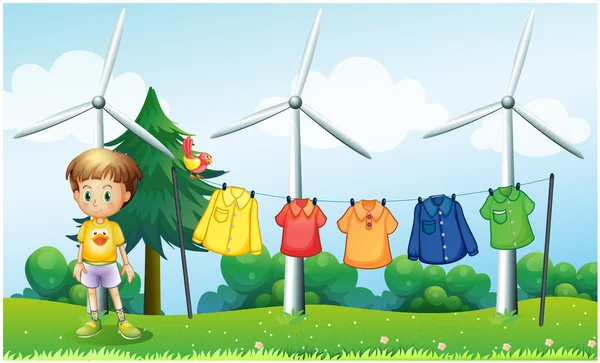 Hanging clothes at the hill near the windmills — Stock Vector