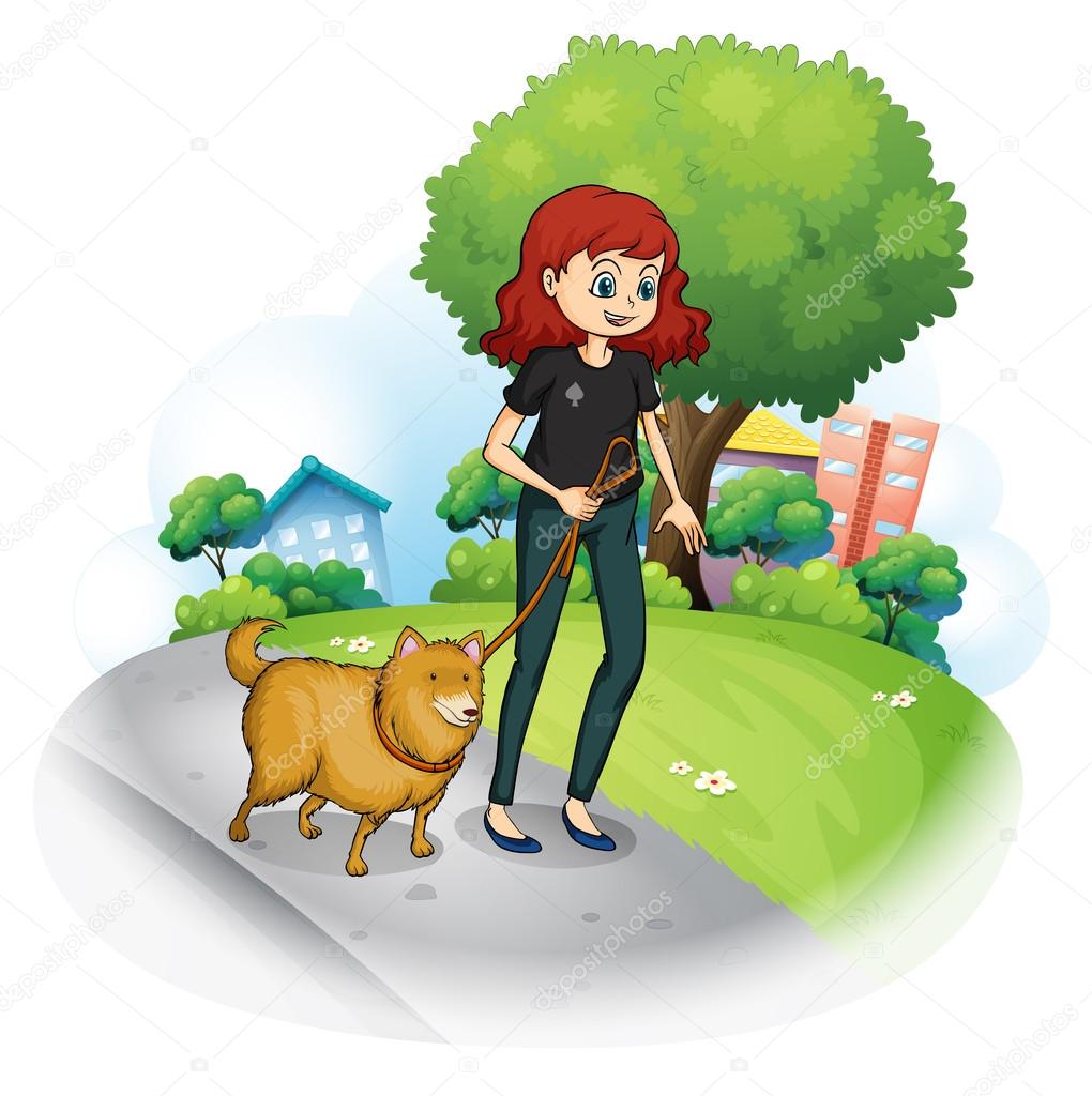 A girl with a dog walking along the street