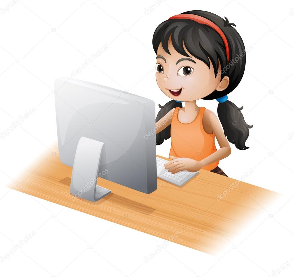 A young girl using the computer