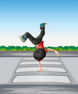 A boy breakdancing at the pedestrian lane clipart