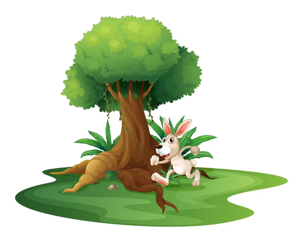 Un conejo jugando cerca del gran árbol — Vector de stock