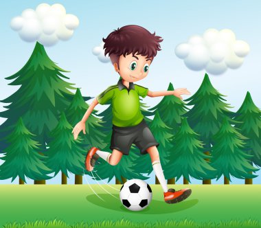 A boy kicking a soccer ball near the pine trees vector A boy kicking a soccer ball near the pine trees vector