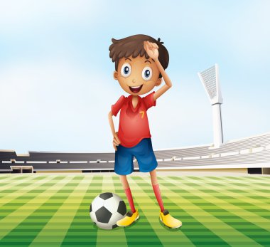 A male soccer player at the field clipart