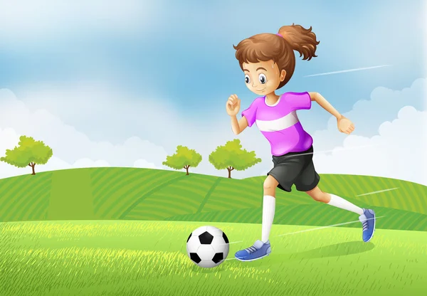 A girl playing soccer at the field — Stock Vector