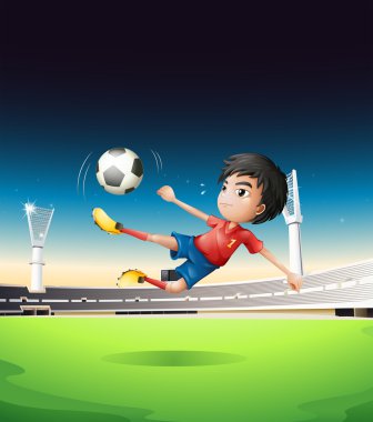 çocuğun futbol sahası, bir kırmızı üniforma