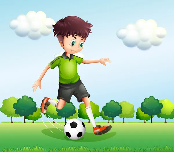 Un chico con una camiseta verde jugando al fútbol — Vector de stock
