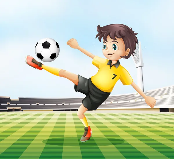 A football player kicking the ball — Stock Vector