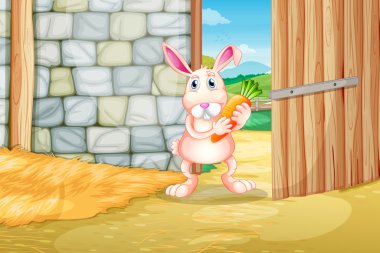 A bunny holding a carrot inside the barn clipart