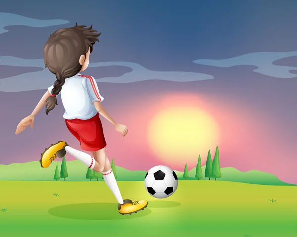 Uma menina jogando futebol à tarde —  Vetores de Stock