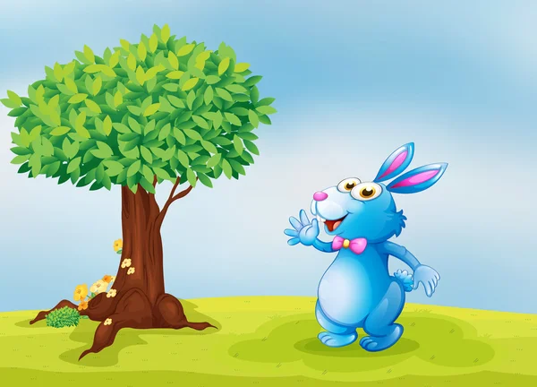 Een blauwe bunny naast een boom — Stockvector