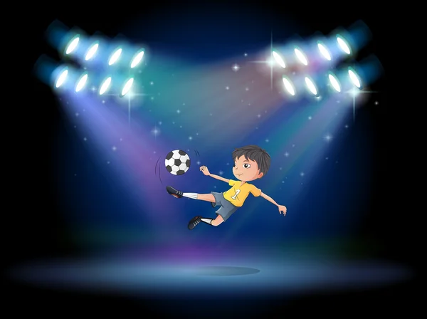 A boy kicking the soccer ball at the stage — Stock Vector