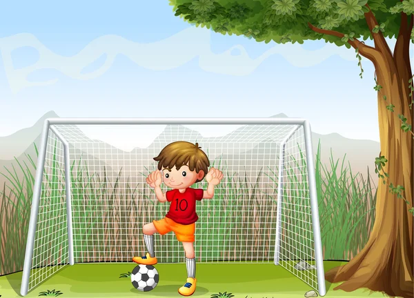 Молодой футболист возле большого дерева — стоковый вектор