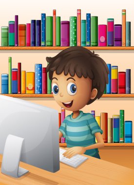 bilgisayarı kullanarak kitaplık içinde bir oğlan
