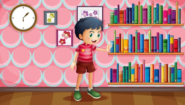 A boy standing beside the wooden shelves with books — Stock Vector
