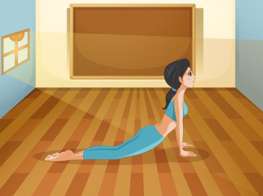 Yoga ile boş bir tahta bir oda içinde gerçekleştiren bir Bayan