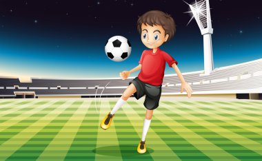 bir topu tekmeleme bir futbolcu