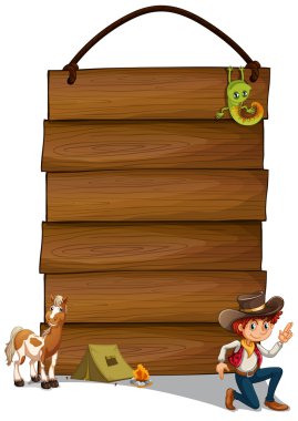 bir kovboy ve hayvanlar ile asılı boş tabela