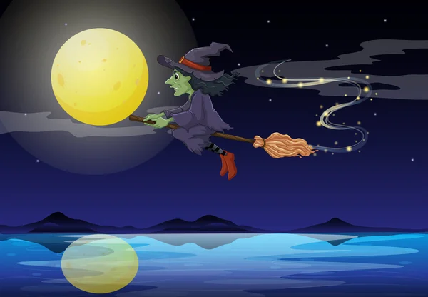 En häxa som rider på en kvast i ett månsken landskap Stockvektor