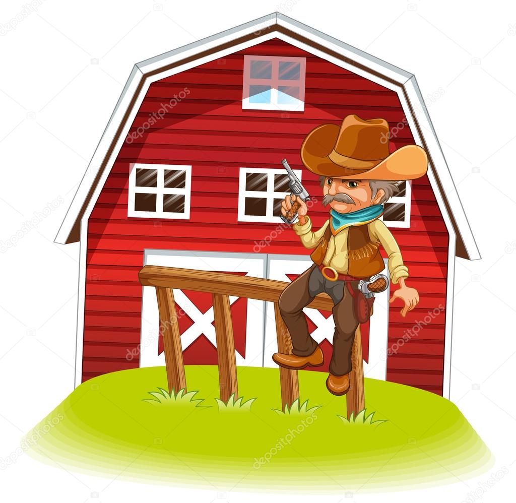 A cowboy holding a gun sitting on a wood in front of the barnhou