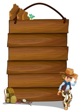 bir kovboy ve boş ahşap levha