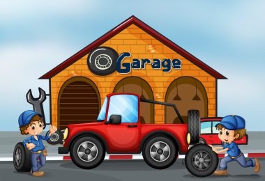 garajda çalışan iki erkek