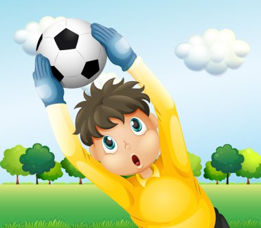 A boy playing soccer with a yellow uniform clipart