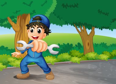 bir İngiliz anahtarı tutan bir mekanik adam