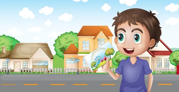 A boy holding a picture in front of the houses near the road — Stock Vector