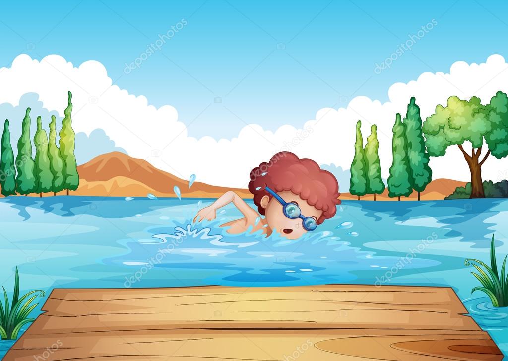 A boy swimming near the diving board