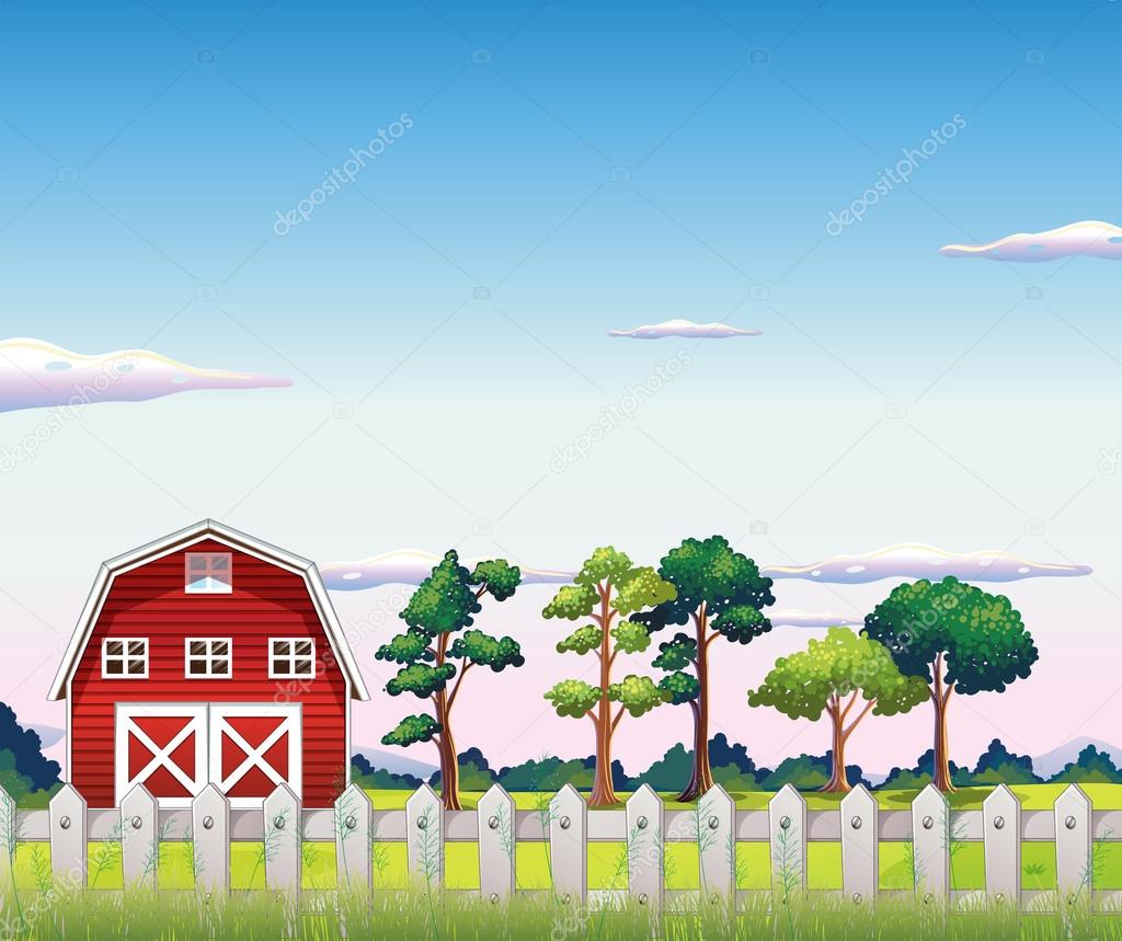 A red barnhouse inside the fence