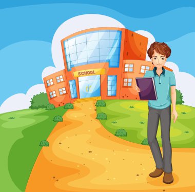 bir kitap okul binası dışında ayakta tutan bir çocuk