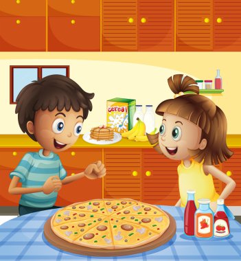Mutfakta çocuklarla masadaki tüm pizza