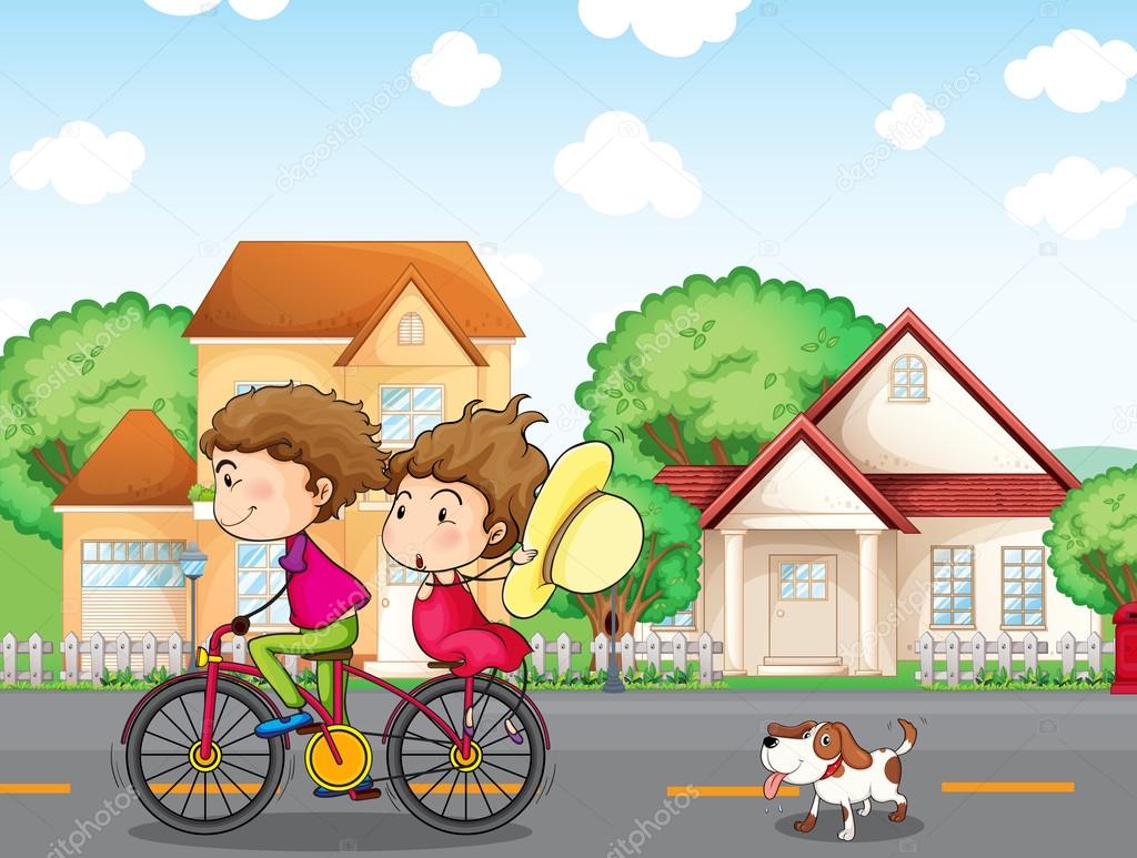 A boy and a girl biking followed by a dog