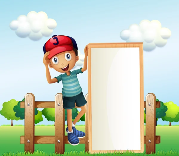 Chłopiec stoi w czapce przytrzymanie puste signa ogrodzenia — Wektor stockowy