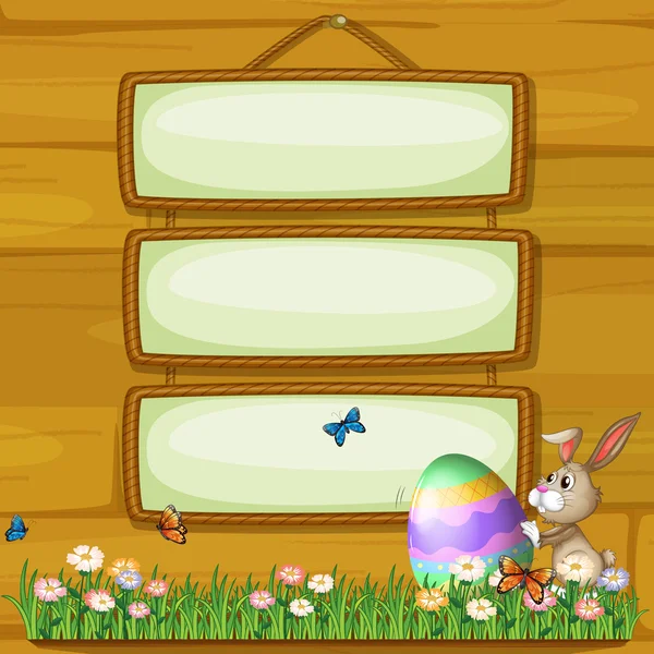 En kanin som driver ett ägg framför den hängande skyltar — Stock vektor