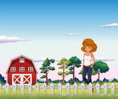 Kırmızı barnhouse çit içinde yakın duran bir kız