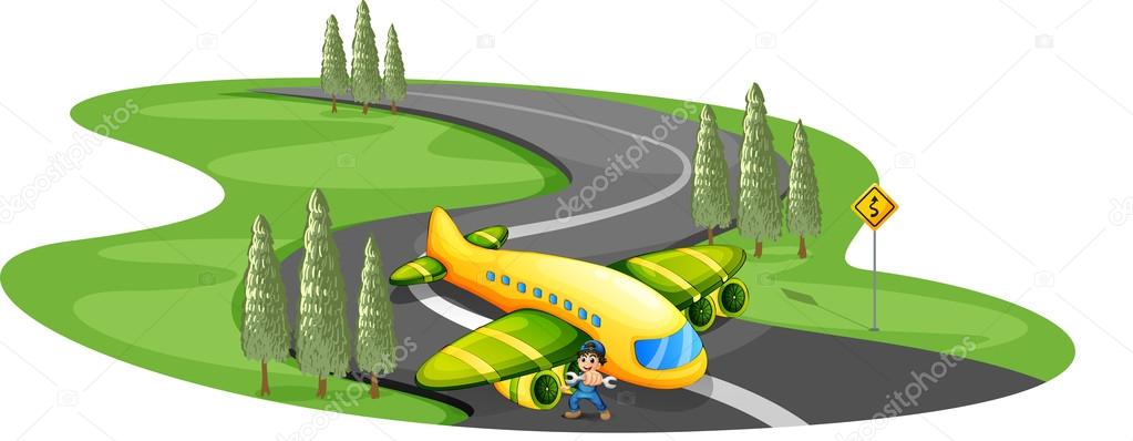 A boy with a plane landing at the long winding road
