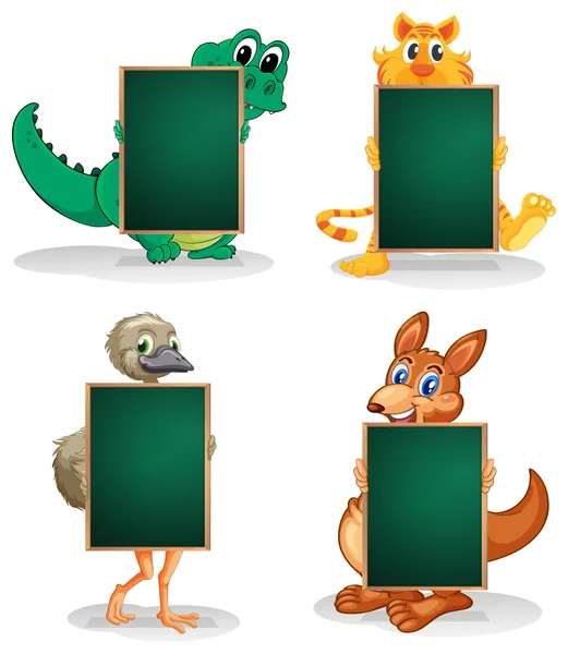 Four animals at the back of the empty blackboards — Stock Vector