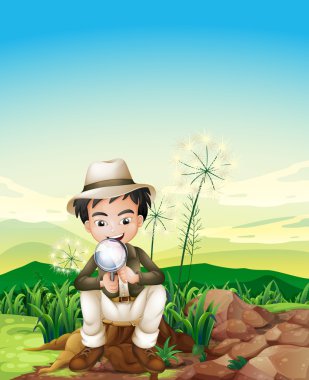 Büyüteç lens holding kütük oturan bir çocuk