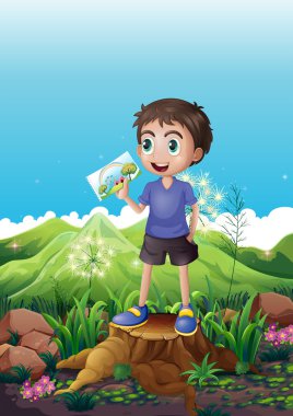 kütük üstüne bir resim ayakta tutan bir çocuk