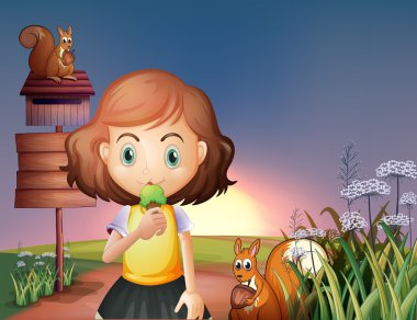 genç bir kız bir tabela ile Hill bir dondurma yeme ve