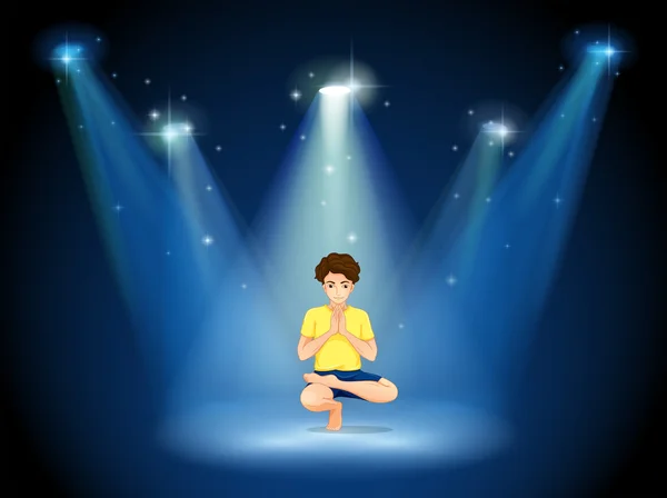 Um menino fazendo ioga no palco — Vetor de Stock