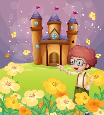A boy pointing near the flowers in the hill with a castle clipart