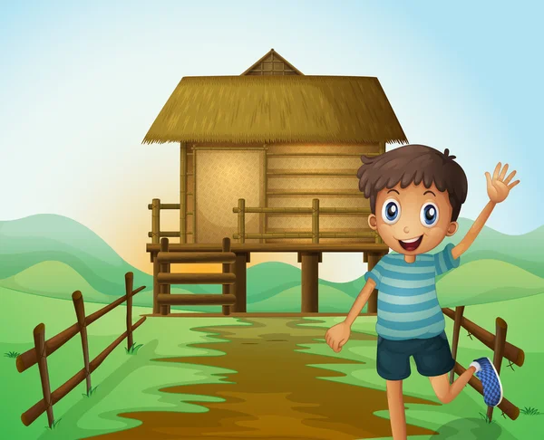 A boy waving his hand in front of a nipa hut — Stock Vector