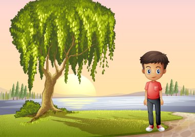 dev bir ağacın yanında duran bir çocuk