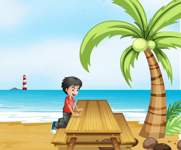 Un ragazzo in spiaggia con un tavolo di legno vicino al cocco — Vettoriale Stock